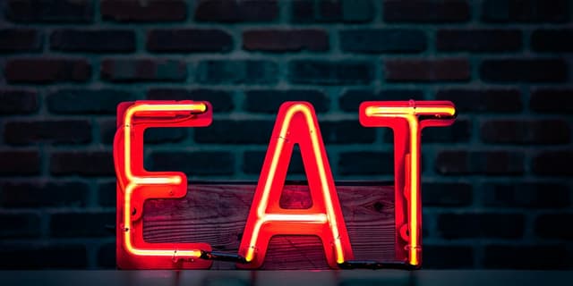 Neon sign reading Eat