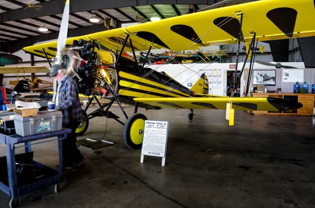 A Travel Air 2000 aircraft on display inside the Owls Head Transporation Museum