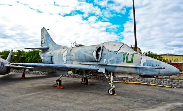 Vintage military aircraft on display outside of the Planes of Fame Air Museum